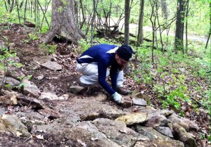 Scott Lillis puts finishing touches on the rock garden.
