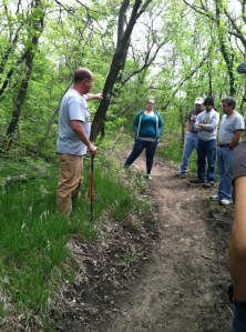 Neil Taylor, left, of the Kansas Trails Council provides instruction to members of Saturday's trail maintenance course at Clinton State Park.